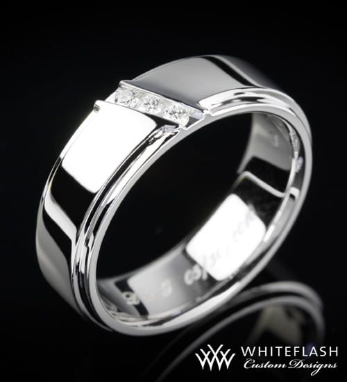 This custom made men 39s wedding band is set in 14 carat gold and the diagonal