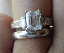 emerald in diamond baguette setting.jpg