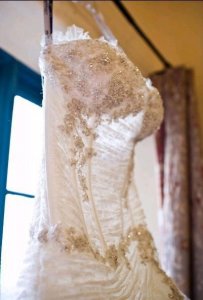 wedding miracles dress in window.jpg