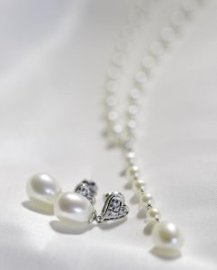 4necklace and earrings on bed.JPG