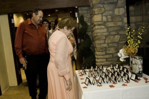 4 people getting escort cards.JPG