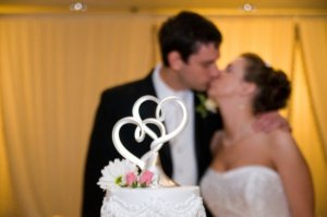 kiss behind cake.jpg