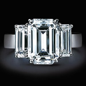emerald cut three stone.jpg