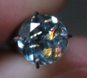 Blue green tourmaline with weird inclusion.jpg