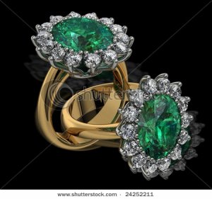 stock-photo-emerald-and-diamond-cluster-rings-on-black-24252211.jpg
