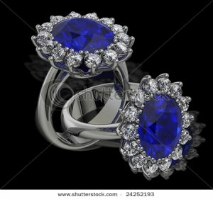 stock-photo-sapphire-and-diamond-cluster-rings-on-black-24252193.jpg