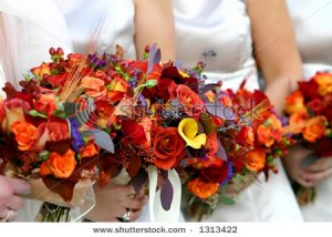 stock-photo-red-and-orange-flower-bouquet-on-a-wedding-dress-1313422.jpg