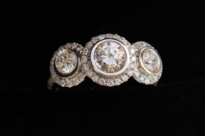 my engagement ring 3 stone halo.jpg my engagement ring 3 stone halo.jpg