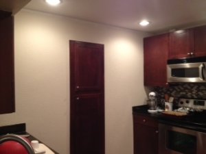 kitchen wall getting tiled.JPG