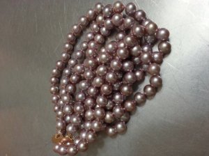 lavender_triple_strand_pearl_necklace_on_counter.jpg