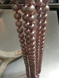 lavender_triple_strand_pearl_necklace_hanging_from_antlers.jpg