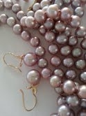 lavender_blossom_earrings_next_to_necklace.jpg
