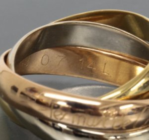 an authentic Cartier Trinity ring 