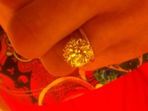wearingredatworkadmiringring.jpg