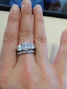 three_stone_2ct_center_on_middle_finger.jpg three_stone_2ct_center_on_middle_finger.jpg