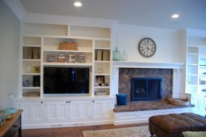 built-in-stereo-and-tv-cabinet-next-to-fireplace.jpg