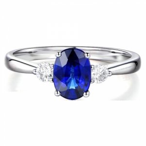 trilogy-half-carat-oval-cut-sapphire-and-round-diamond-engagement-ring-in-white-gold.jpg