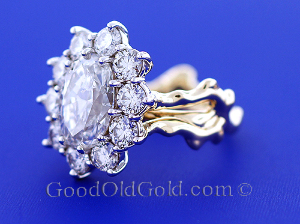 ss_custom_made_halo_style_ring_with_238cttw_g_si1_and_301ct_g_si1_oval_profile_0.jpg