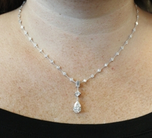 custom-pear-and-baguette-diamond-necklace-in-platinum-by-whiteflash_38528_neck_shot_copy.jpg