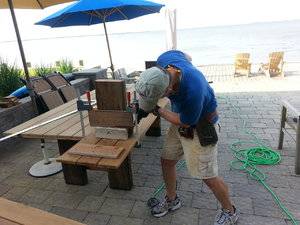 gregworkingonbeachtable.jpg