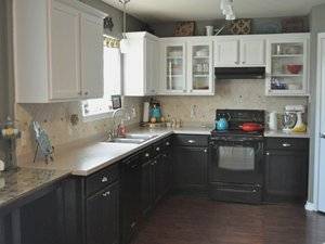 upper-cabinets-black-bottom-kitchen-cabinets-black-oven-on-black-wooden-floor.jpg