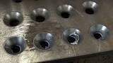 beveled hole in metal.jpeg