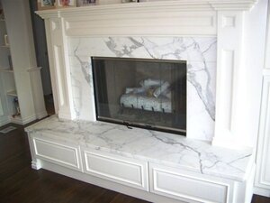 4cfbfed4792f41674a71908c6be34c9c--marble-hearth-marble-fireplace-surround.jpg