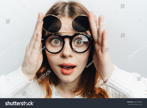stock-photo-cartoon-woman-with-round-glasses-with-huge-eyes-525739858.jpg