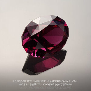 doug-menadue-bespoke-gems-raspberry-pink-red-rhodolite-garnet-supernova-oval-1252b.jpg