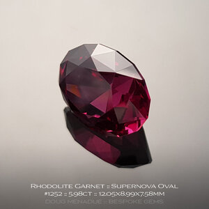 doug-menadue-bespoke-gems-raspberry-pink-red-rhodolite-garnet-supernova-oval-1252d.jpg