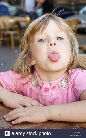 little-girl-sticking-her-tongue-out-B4GFHA.jpg
