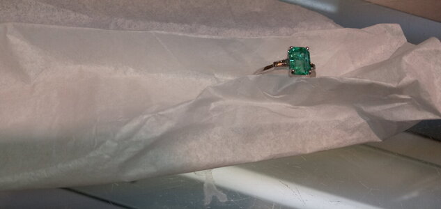 platinum 950 ring with 1.5 cts untreated colombian emerald with two side diamonds.jpg
