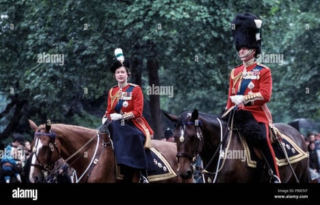 a-young-queen-elizabeth-ii-and-prince-philip-ride-their-horses-from-F90CNT.jpg