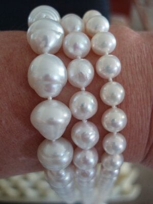 3 white pearls on wrist- SSP, baroque akoya, metallic white FWP.jpeg
