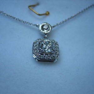 LTP's .46 ct. OEC pendant with bezel set .20 ct. OMC