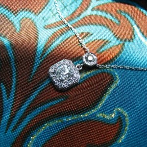 LTP's .46 ct. OEC pendant with bezel set .20 ct. OMC