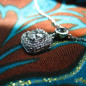 LTP's .46 ct. OEC pendant with bezel set .20 ct. OMC