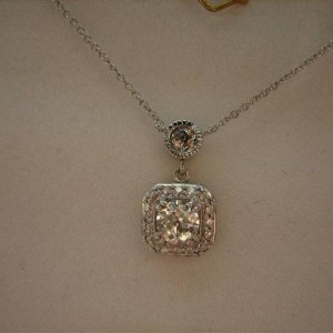 LTP's .46 ct. OEC pendant with bezel set .20 ct. OMC