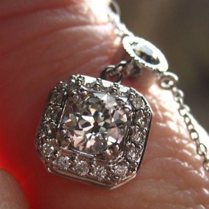 LTP's .46 ct. OEC pendant with bezel set .20 ct. OMC