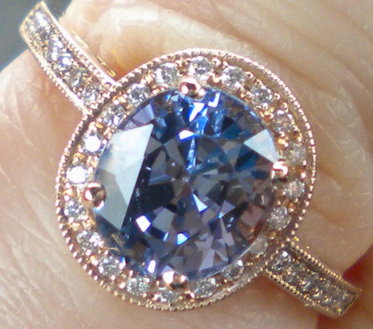 2.8 carat Tanzanian periwinkle blue spinel in 18K rose gold and diamond halo.