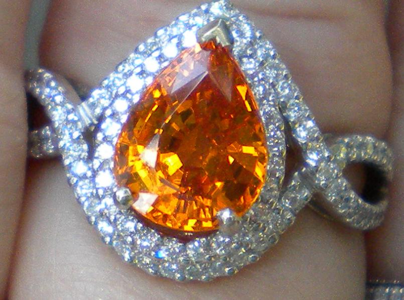 4 carat spessartite viewed outdoors on a cloudy day
