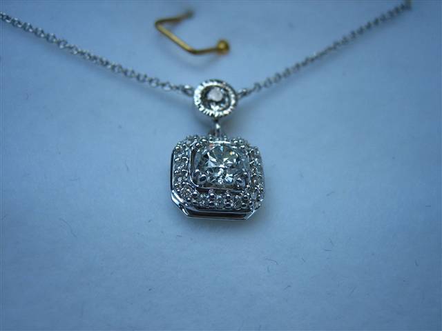 LTP's .46 ct. OEC pendant with bezel set .20 ct. OMC