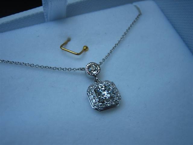 LTP's .46 ct. OEC pendant with bezel set .20 ct. OMC