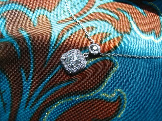 LTP's .46 ct. OEC pendant with bezel set .20 ct. OMC