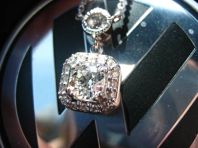 LTP's .46 ct. OEC pendant with bezel set .20 ct. OMC