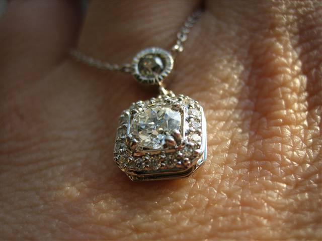 LTP's .46 ct. OEC pendant with bezel set .20 ct. OMC