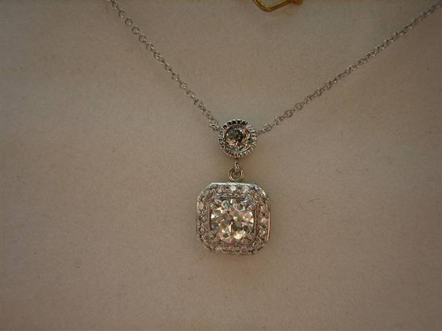 LTP's .46 ct. OEC pendant with bezel set .20 ct. OMC