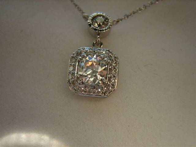 LTP's .46 ct. OEC pendant with bezel set .20 ct. OMC