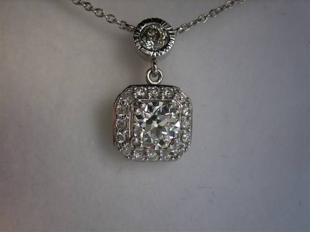 LTP's .46 ct. OEC pendant with bezel set .20 ct. OMC