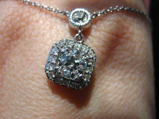 LTP's .46 ct. OEC pendant with bezel set .20 ct. OMC